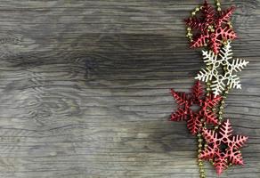 Christmas decorations on old wooden background. photo