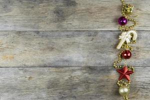 Christmas decorations on old wooden background. photo