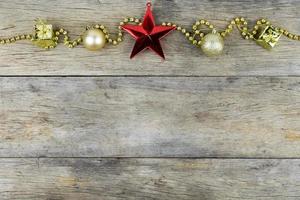 Christmas decorations on old wooden background. photo