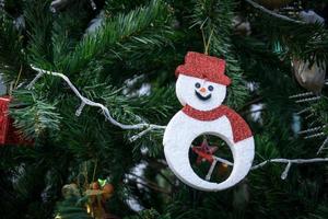 Christmas Decor on Snowman and fir tree photo