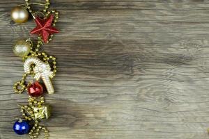 Christmas decorations on old wooden background. photo