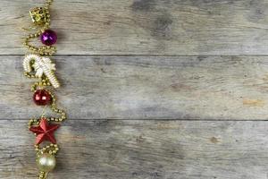 Christmas decorations on old wooden background. photo