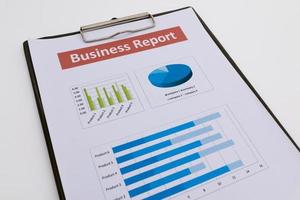 business report and man hand. photo