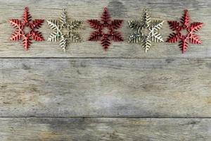 Christmas decorations on old wooden background. photo