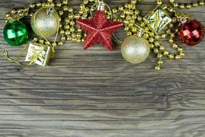 Christmas decorations on old wooden background. photo