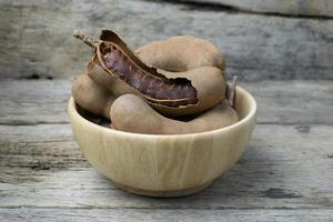 tamarind on grunge wooden background photo