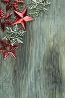 Christmas decorations on old wooden background. photo