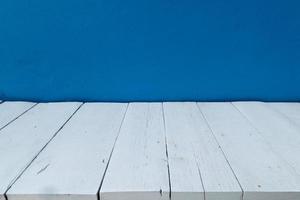 Blue wall and wooden floor interior background photo