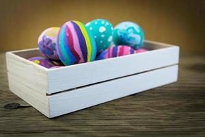 Easter eggs on wooden background. Selective focus. photo