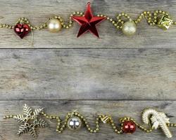 Christmas decorations on old wooden background. photo