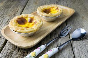 delicious portuguese egg tart on wood background photo