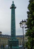 Obelisk in Place Vendome square in Paris France photo