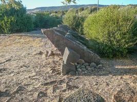 Ruins of ancient Sunuxi Nuraghe megalithic building in Sardinia, photo