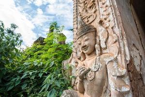 The angel guardian statue standing in front of the ancient pagoda in Inle lake of Myanmar. photo