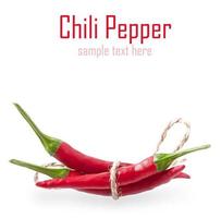 Red hot chili peppers tied with rope isolated on white background photo