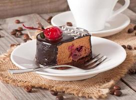 Sweet dessert fruitcake with a cherry photo