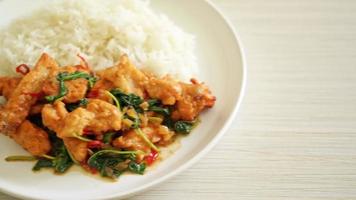 stir-fried fried fish with basil and chili in thai style topped on rice - Asian food style video