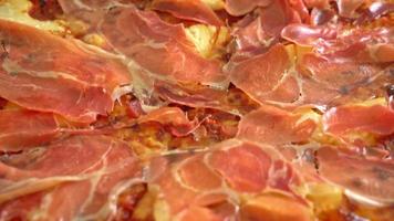 Pizza with prosciutto or parma ham pizza - Italian food style video