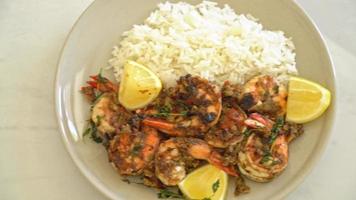 jerk shrimps or grilled shrimps in Jamaica style with lemon and rice