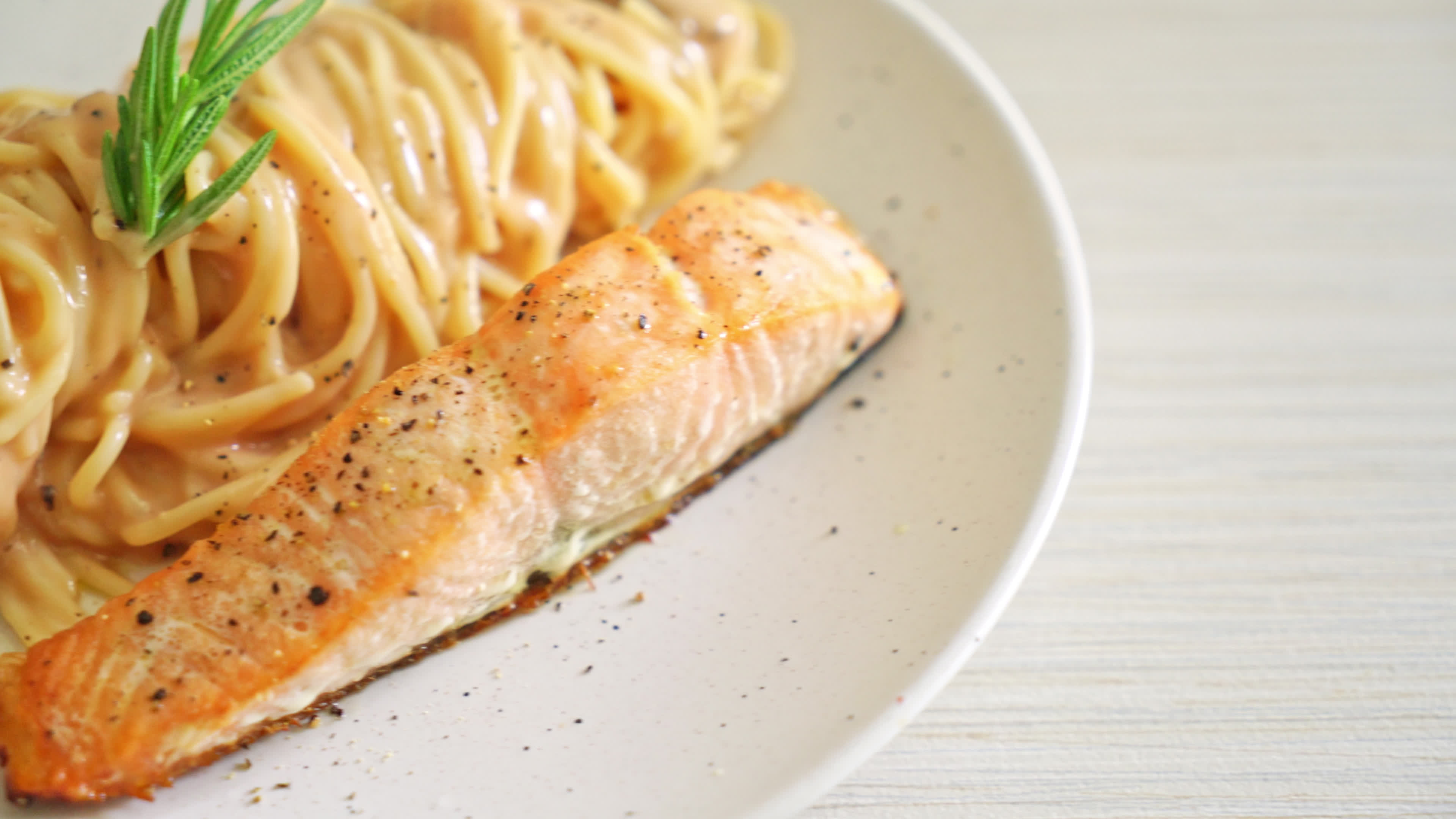 grilled salmon fillet with spaghetti creamy tomato sauce 7024937 Stock ...