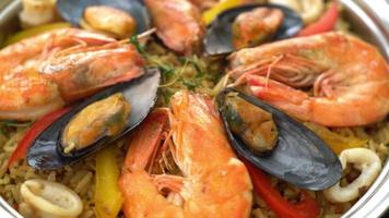 Seafood Paella with prawns, clams, mussels on saffron rice - Spanish food style video