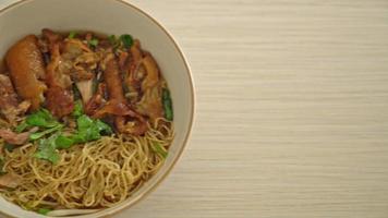 Stewed pork leg noodles in brown soup