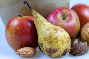 Still life display of Apples, Pears and nuts photo