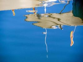 Reflections of boats in the marina at Marbella photo