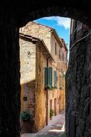 PIENZA, TUSCANY, ITALY, 2013. Old buildings down ang alleyway photo