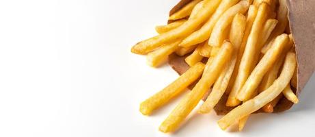 Appetizing french fries on white background. Hot fast food. Place for text. photo