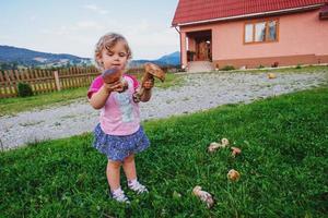 child with mushrooms photo