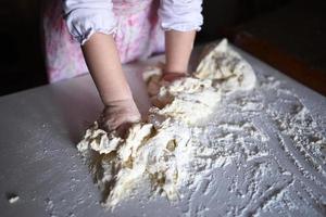 child knead dough photo
