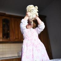 child preparing dough photo