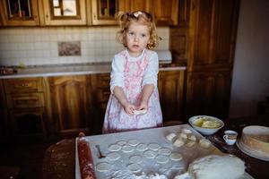 child preparing dough photo