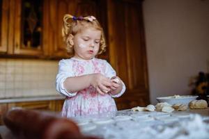 child preparing dough photo