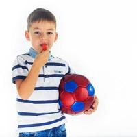 little boy footballer isolated photo