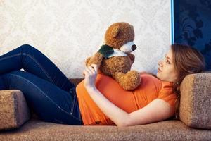 pregnant woman with toy photo