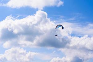 Skydiver in the clear sky photo