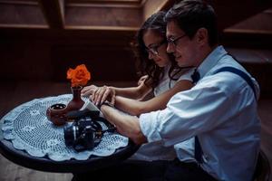 Romantic couple in love bonding in cafe photo