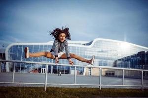 young carefree woman jumping photo