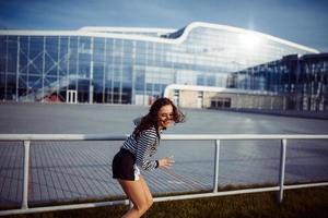 young carefree woman jumping photo