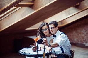 Romantic couple in love bonding in cafe photo