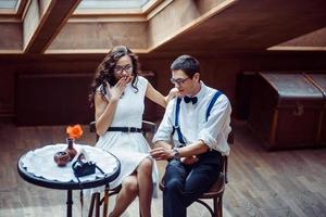 Romantic couple in love bonding in cafe photo