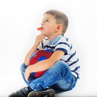 little boy footballer isolated photo