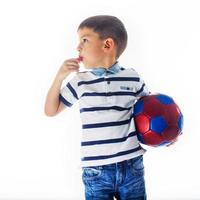 little boy footballer isolated photo