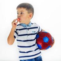 little boy footballer isolated photo