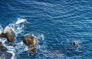 noisy sea with stones photo