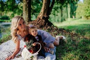woman with a child on a walk on a sunny day photo