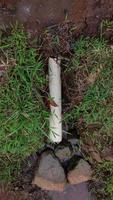 PHOTOS OF FARMER'S SIMPLE WATER DISPOSAL, DAY TIME . made using simple materials using bamboo. some use a pipe.