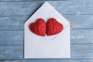 Love hearts on wooden texture background. Valentines day card concept. Heart for Valentines Day Background. photo